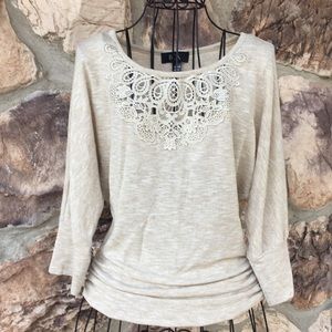 BCX 3/4” sleeve blouse with cut out lace detail.